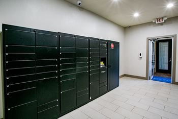 a row of lockers in a room with a door open